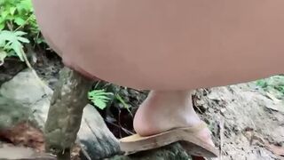 Asian Beauty - pooping in the river