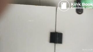 Asian restroom under stall spy