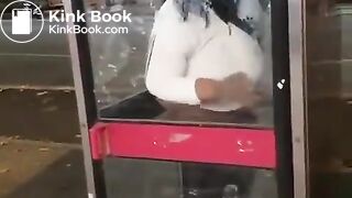 Black woman shit in a phone booth