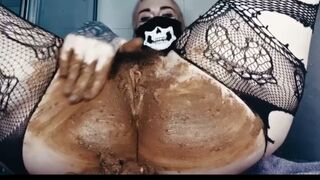 Betty in fishnet masturbating with scat smear