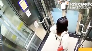 Asian woman shitting in an elevator
