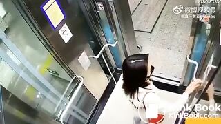 Asian woman shitting in an elevator