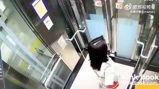 Asian woman shitting in an elevator
