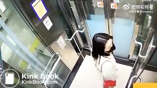 Asian woman shitting in an elevator