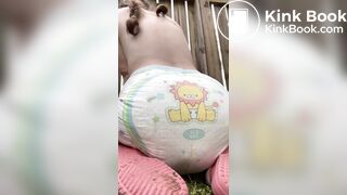 GIrl poops her diaper in her backyard