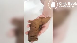 Woman poops in the palm of her hand