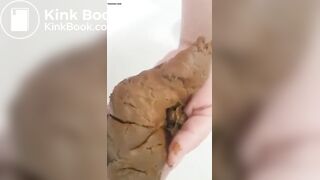 Woman poops in the palm of her hand