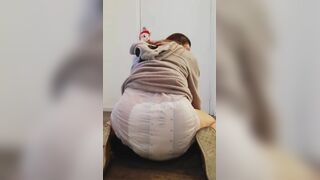 Girl bounces In her messy diaper