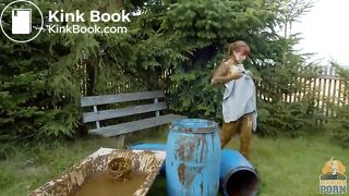 Busty babe masturbating in a bathtub full with cow shit