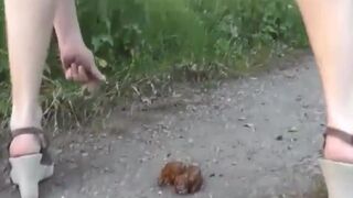 She poops on a trail in the woods..