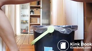 German lady defecates in a trash can..