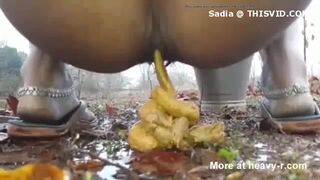 Desi aunty shitting in the open