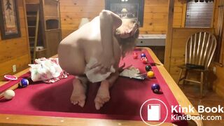 Changing her messy diaper on the pool table