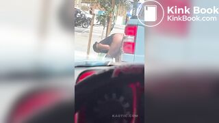 Woman shits on the street.