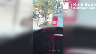 Woman shits on the street.