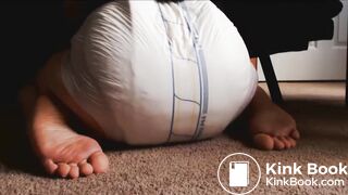 Releasing enema into diaper and showing the result