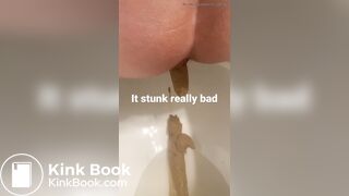 young long turd toilet