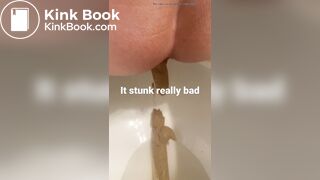 young long turd toilet