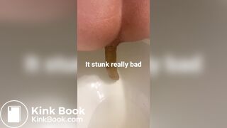 young long turd toilet