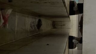 Chinese lady poops painful diarrhea in public toilet.