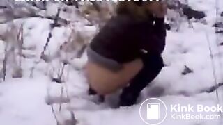 Girl pooping in snow