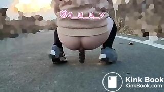 Japanese Twitter girl outside big long poop