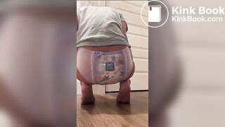 Diaper girl messing and wetting