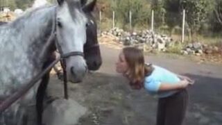 White girl poops outside near a farm