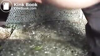 White girl poops outside near a farm