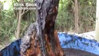 Thai girl taking a bath in cow shit.