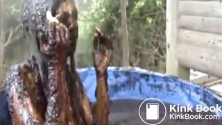 Thai girl taking a bath in cow shit.