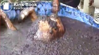 Thai girl taking a bath in cow shit.