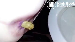 Girl takes a shit in the toilet