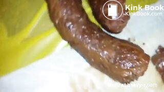 Sucking and licking her own big turd