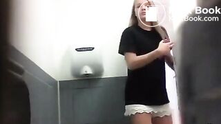 Two beautiful girls pooping on toilet