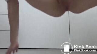 Pink haired lady open wide her legs and pooping