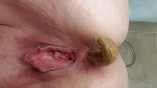 Close up chubby girl has a loose crackling poop
