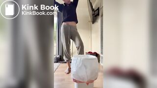 Fit tattooed chick shitting diarrhea in bucket