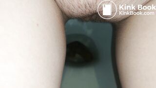 Showing hairy pussy while shitting