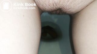 Showing hairy pussy while shitting
