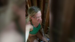 Girl pooping at building site