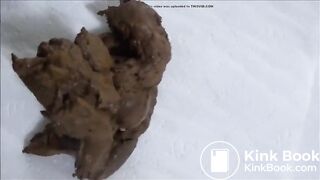 Beautiful constipated girl squeezes out shit