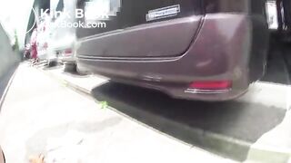 Asian girl pooping in public parking lot