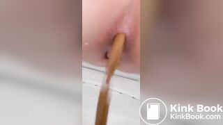 Girl emptying on the toilet