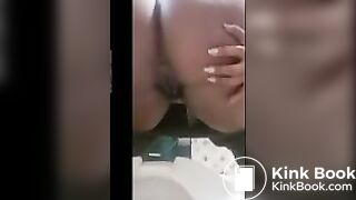 Queen pooping on toilet.