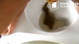 Woman reverse squat pooping on toilet