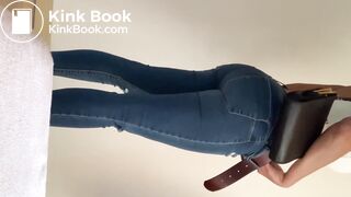 Sexy Woman fills her jeans in the bathroom