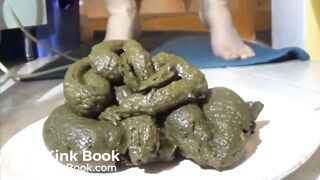 Girl shits a huge pile of green shit on a plate