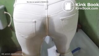 African shitting and pissing her white pants
