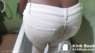 African shitting and pissing her white pants